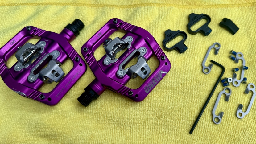 mountain bike pedals - the oneup clip pedals feature adjustable float, adjustable traction...