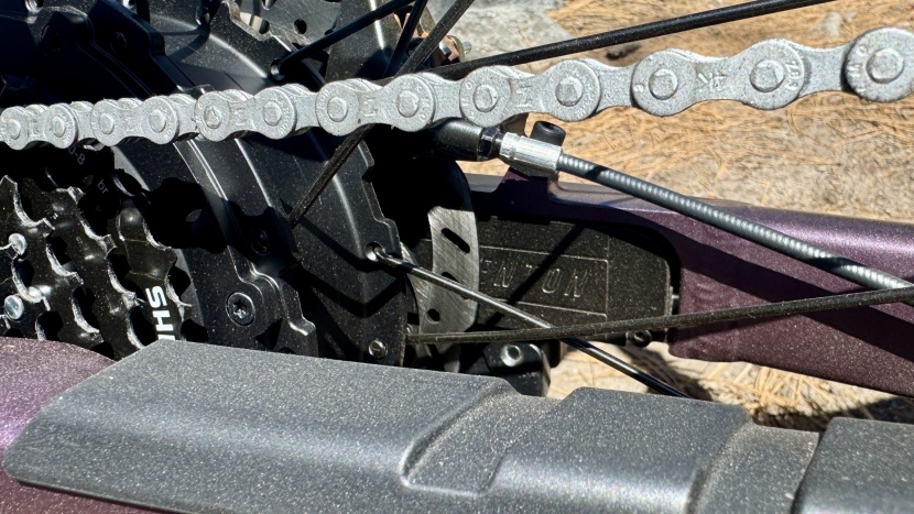 aventon level 3 - on the left chainstay is the automatic locking mechanism that pushes...