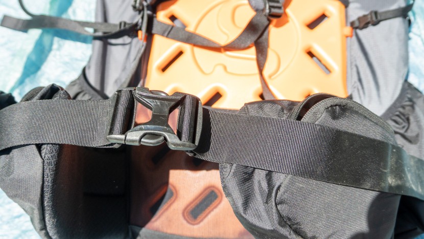 the hip belt uses a center, dual quick adjust buckle.