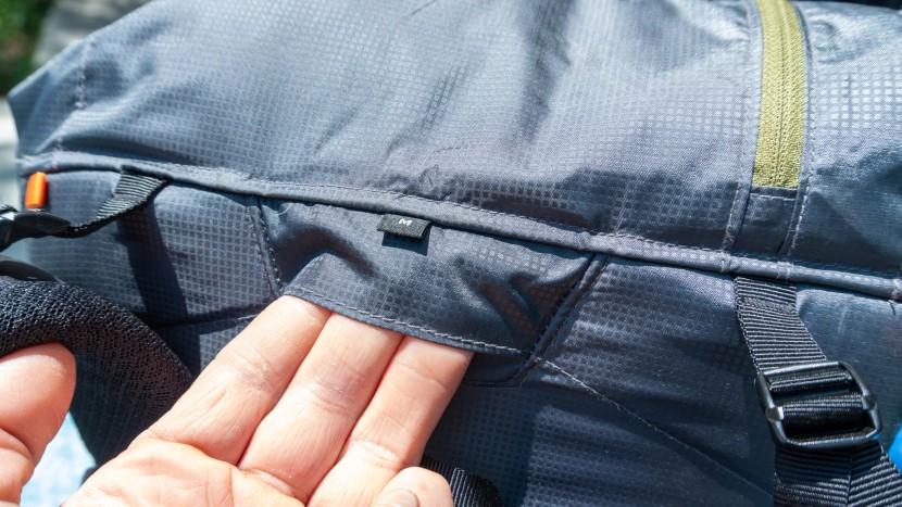 a water bladder hose opening is present on the gorilla and a loop to...