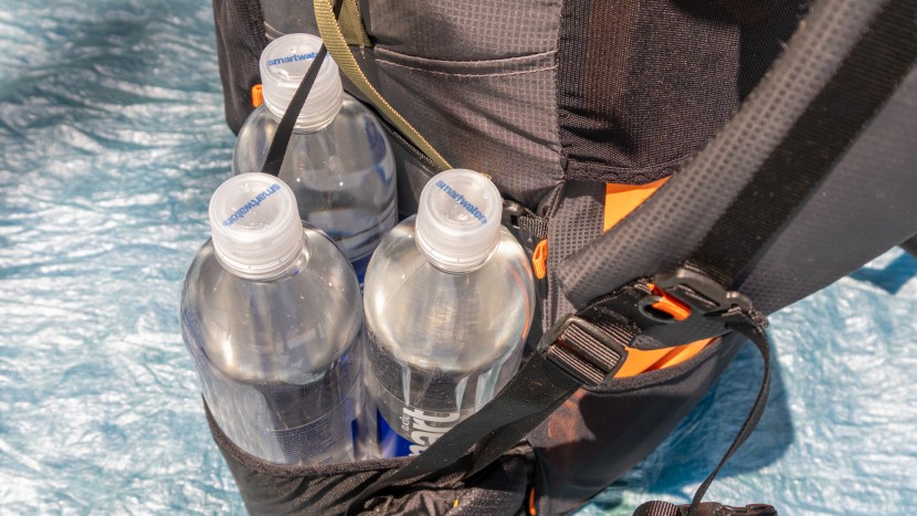 three, 1l smartwater bottles can fit in each of the side pockets.