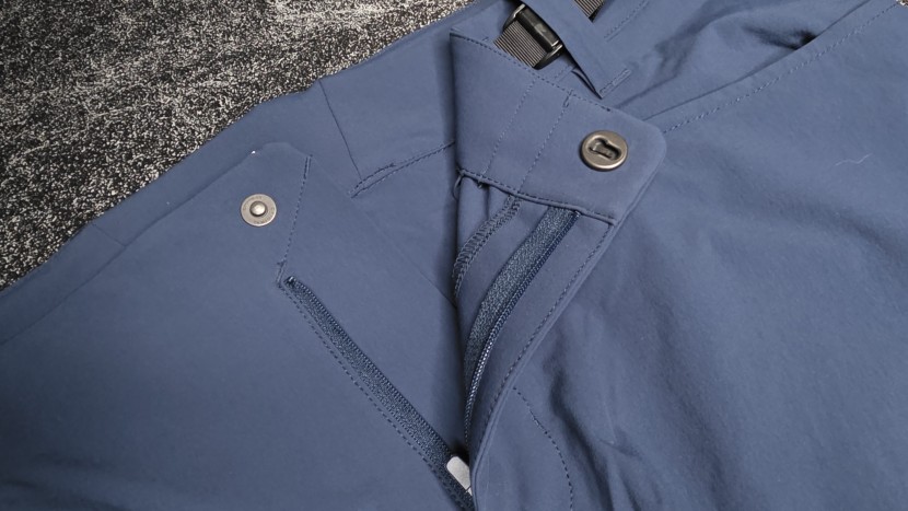 the rapha trail shorts utilize a strange front closure with a...