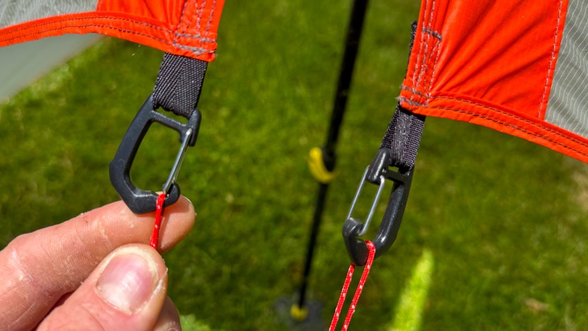 small clips allow you to remove the guy line from the tarp to assist...