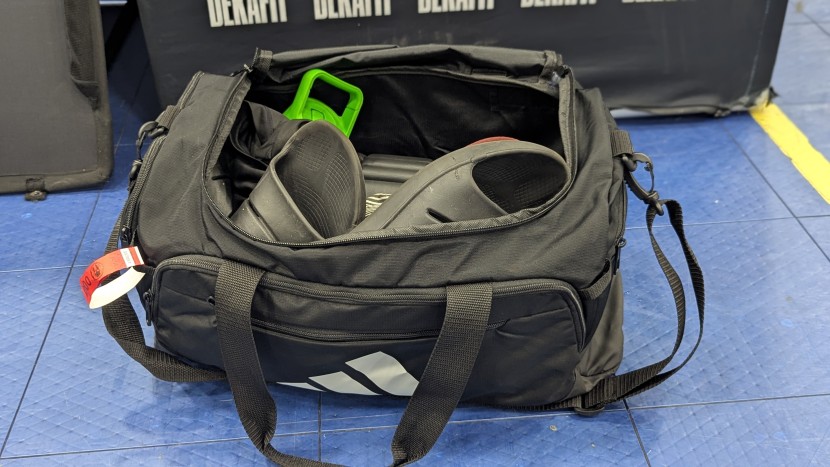 two of the gym-style duffels we tested, the adidas defender (left)...