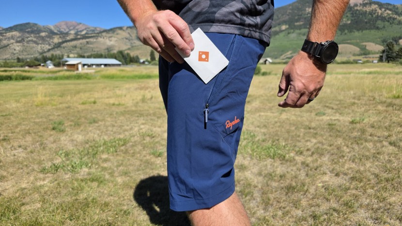 the rapha trail shorts utilize a strange front closure with a...