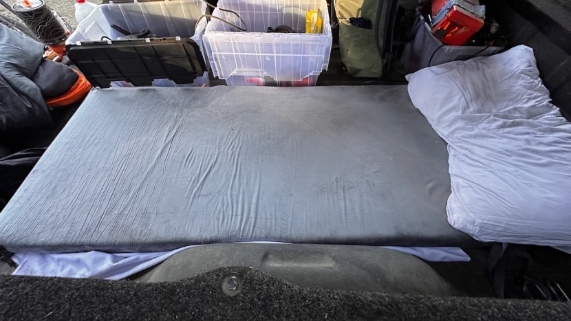 camping mattress - the homemate set up in the back of a truck and surrounded by all our...