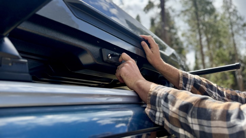 the slidelock system requires you to pinch the tab to open the box.