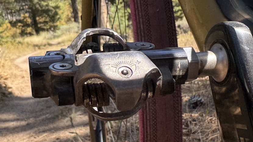 mountain bike pedals - the wider pedal body offers more lateral support, but the binding...