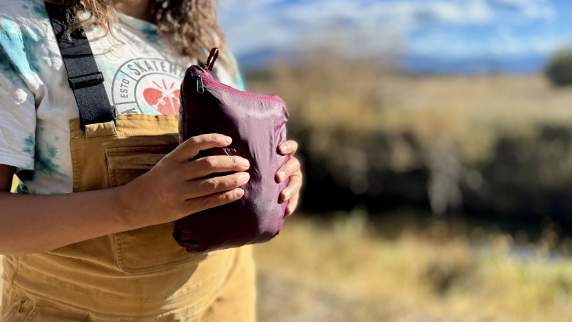 cotopaxi fuego hooded for women - the jacket packs into the inner zippered pocket for easy portability