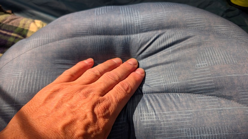 a stretchy air bladder, thick layer of down batting, and five inches...