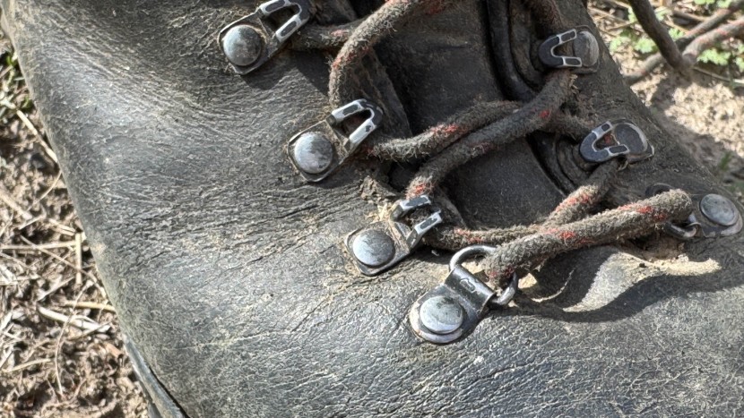 the rugged metal eyelets lost some black paint or coating, resulting...