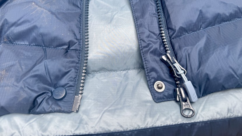 rab neutrino pro for women - the updated jacket has a snap button to help seal the zippers' storm...
