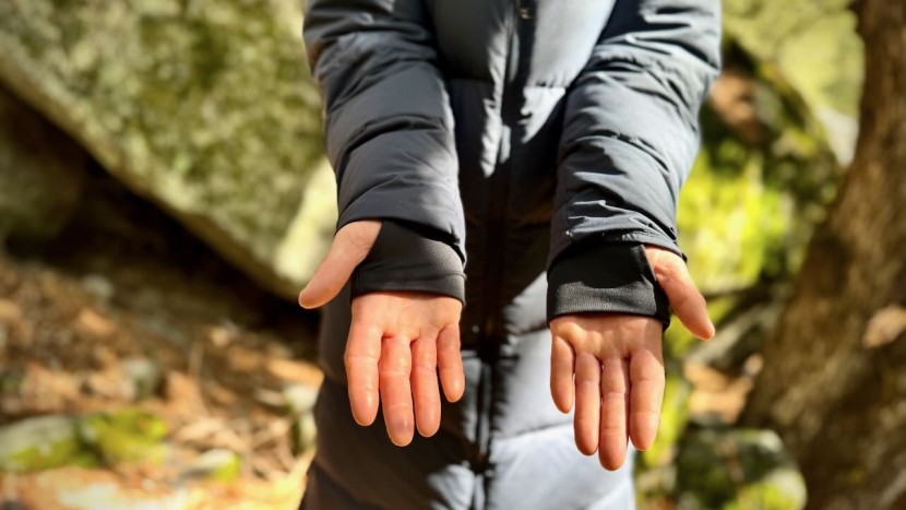 features like cinchable hoods, interior pockets, two-way zippers...