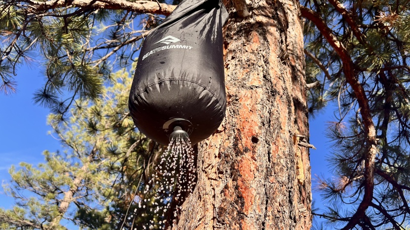 camping shower - setting up the pocket shower is as simple as filling it and hanging...
