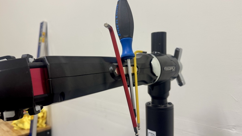 feedback sports pro e lift bike repair stand - a magnet integrated into the clamp head gives you a convenient spot...