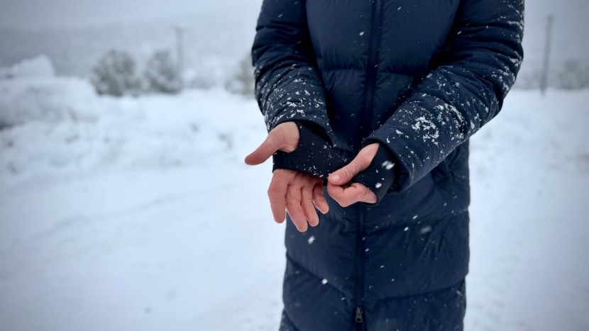 the oversized hood, high collar, wrist gaiters, and long hemline...