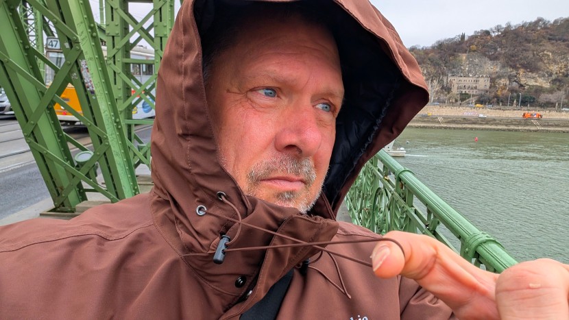 the drawstring around the hood allows you to cinch down the fabric...