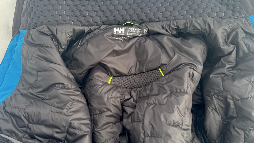 helly hansen alpha lifaloft - the center of this photo shows a mesh vent that lets excess heat and...