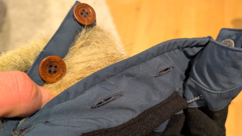 the fur ruff attaches via a set of buttons, and if fully removable...