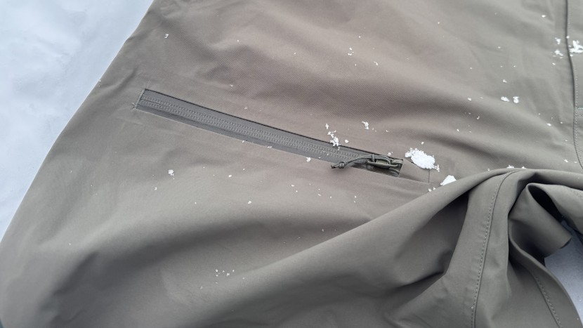 the flylow baker bib uses rugged waterproof zippers with zipper...