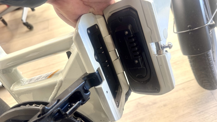 on the right side is the battery that fits snugly inside the frame.